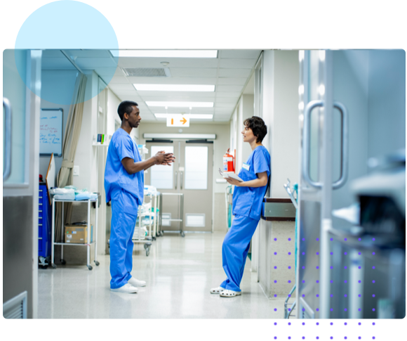 Two hospital workers talking in hallway - HealthStream Nurse Residency