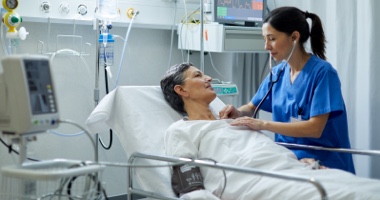 Female nurse student with manikin - Resuscitation Solutions HealthStream