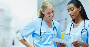Healthcare professionals looking at tablet